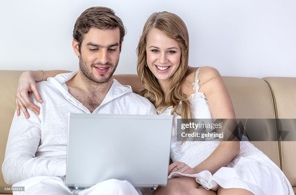 Young happy couple in the living room