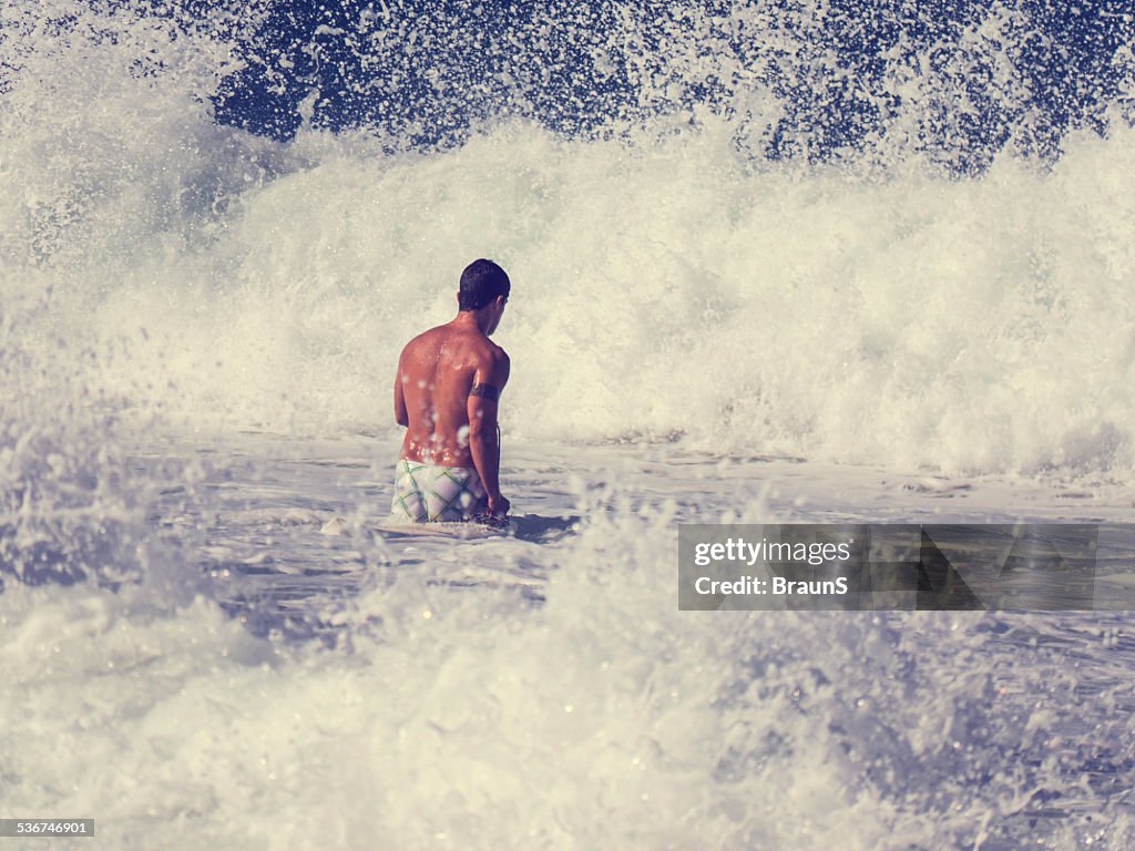 Surfer among waves.