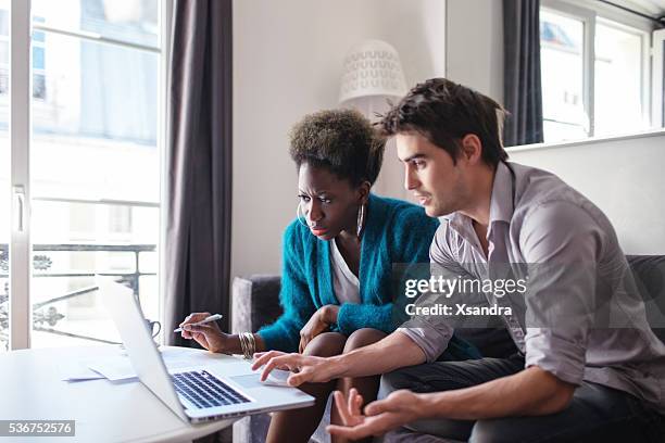 business partners working at home - thinking for investment stock pictures, royalty-free photos & images