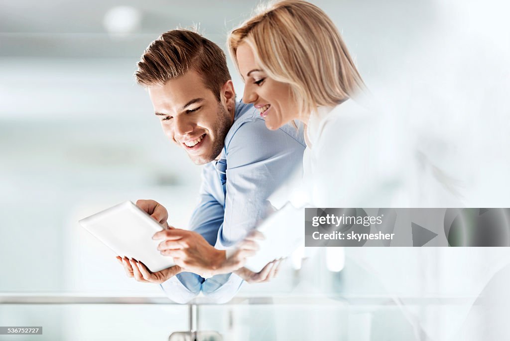 Business colleagues using touchpad.