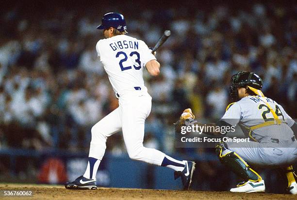 Kirk Gibson of the Los Angeles Dodgers bats in the bottom of the ninth inning of game one against the Oakland Athletics during the 1988 World Series,...