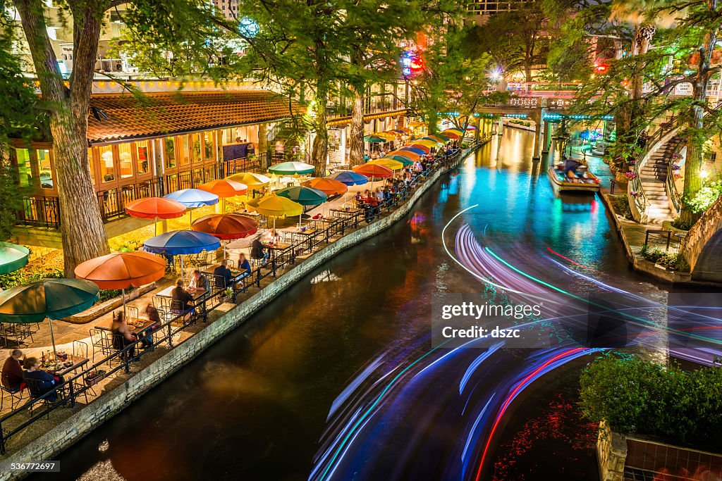 San Antonio Riverwalk, Texas, scenic river canal tourism umbrellas night