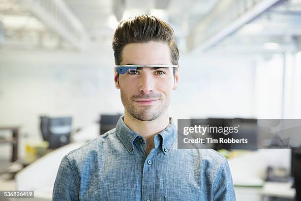 man with smart glasses in office - smart glasses stock pictures, royalty-free photos & images