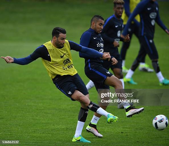 Adil Rami Fra France's defender Adil Rami passes the ball next to France's forward ...