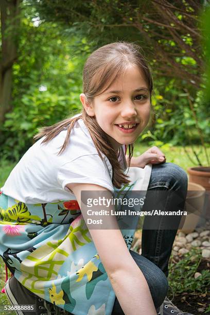 cheerful girl gardening, portrait - alexandra dost stock-fotos und bilder