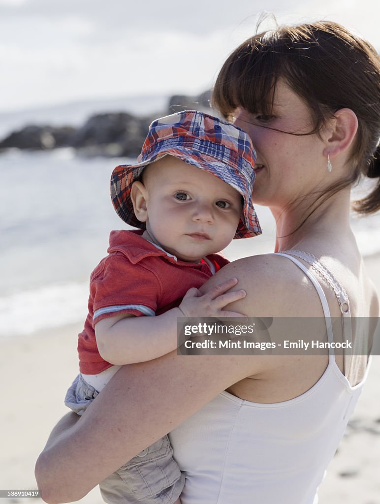 Mother holding her baby son.