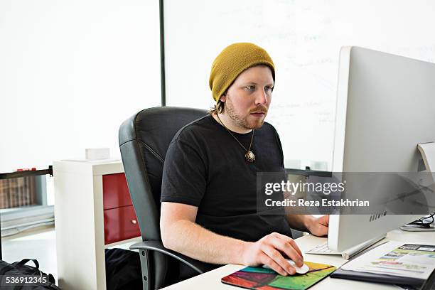 software programmer working at computer - short sleeved stock pictures, royalty-free photos & images