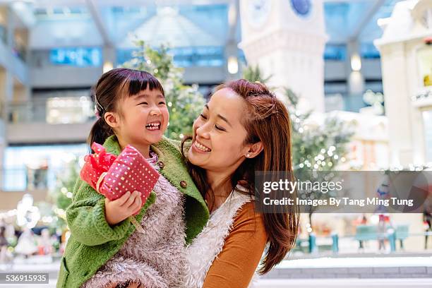 mom shopping with daughter in mall joyfully - chinese young adults shopping imagens e fotografias de stock