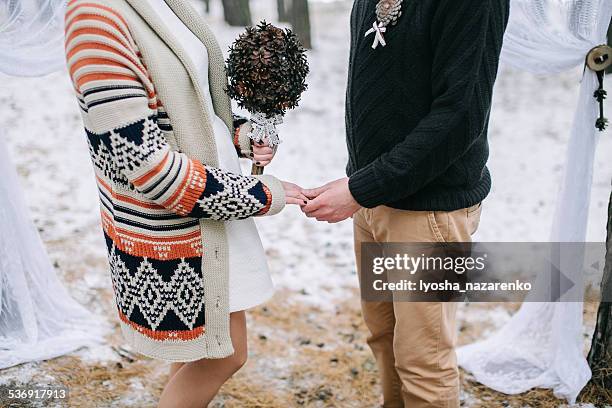 Bride and groom holding hands