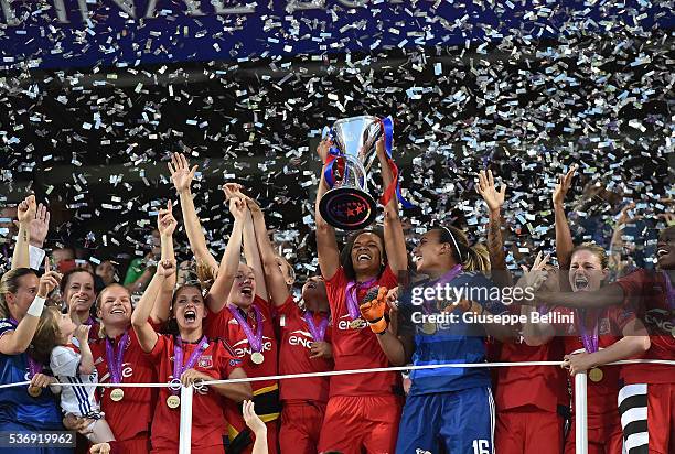 Team captain Wendie Renard of Olympique Lyonnais lifts the winners trophy after UEFA Women's Champions League Final between VfL Wolfsburg v Olympique...