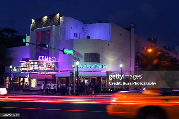 view from across the street of the cameo theater at washington avenue, south beach, florida, at night - theatre building stockfoto's en -beelden