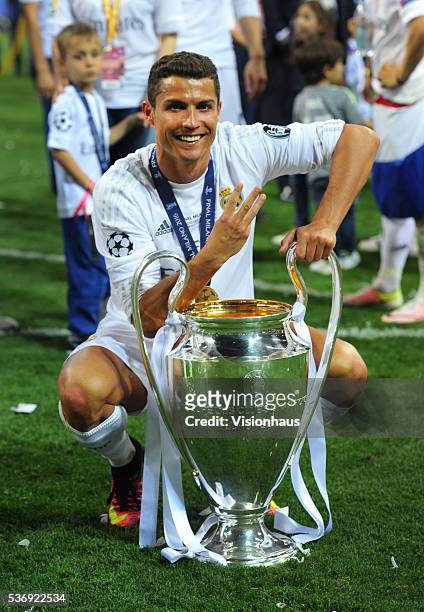 Cristiano Ronaldo of Real Madrid with the Champions League trophy after winning the UEFA Champions League Final between Real Madrid v Club Atletico...