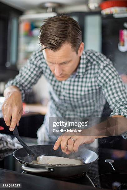 Man Frying Fish 472 Man Frying Fish Stock Photos, High-Res Pictures, and Images - Getty ...