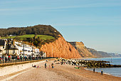 Sidmouth seafront with red cliffs of Jurassic Coast, Devon England