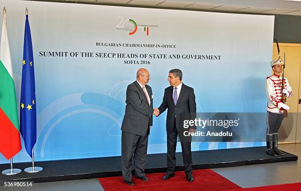 Bulgarian President Rosen Plevneliev shakes hands with OSCE Secretary General Lamberto Zannier during the South-East European Cooperation Process...