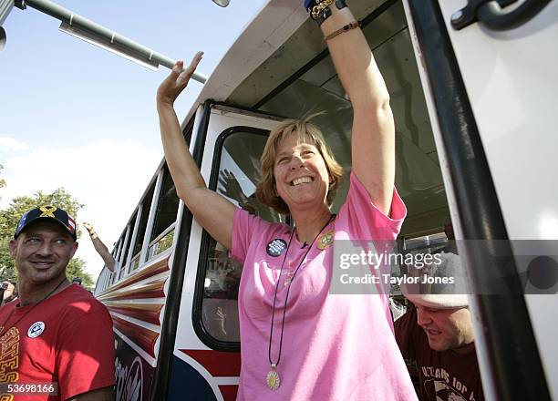 Antiwar activist Cindy Sheehan gestures as she exits a bus on her first stop of a nationwide tour in front of Austin City Hall August 31, 2005 in...