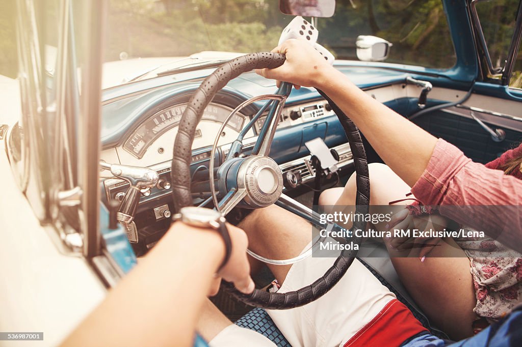 Couple sitting in convertible