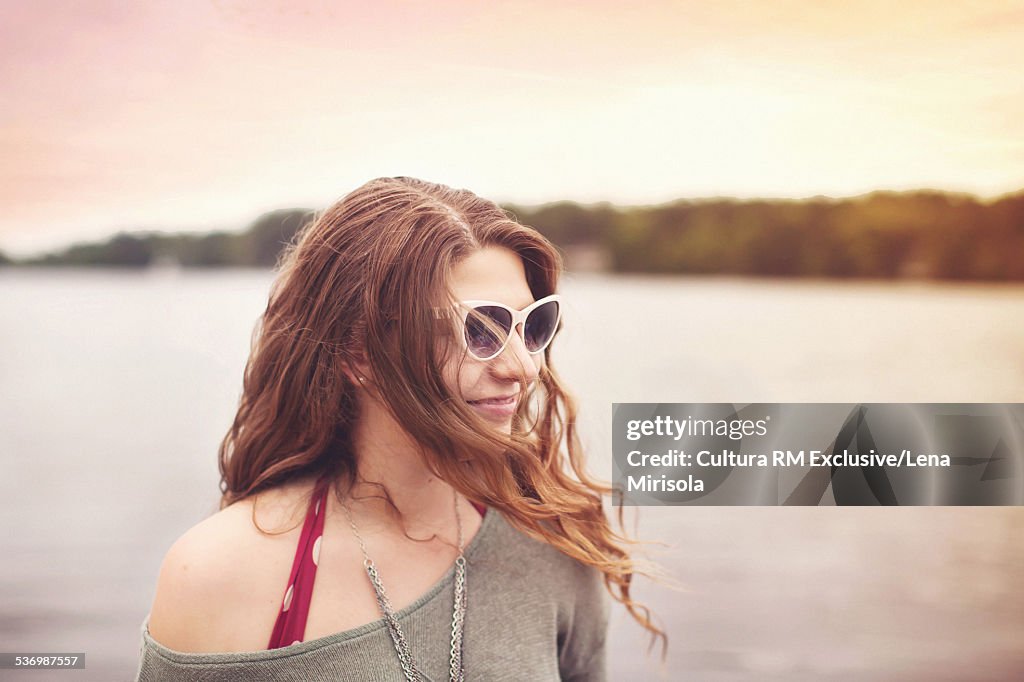 Young brunette woman wearing sunglasses, portrait