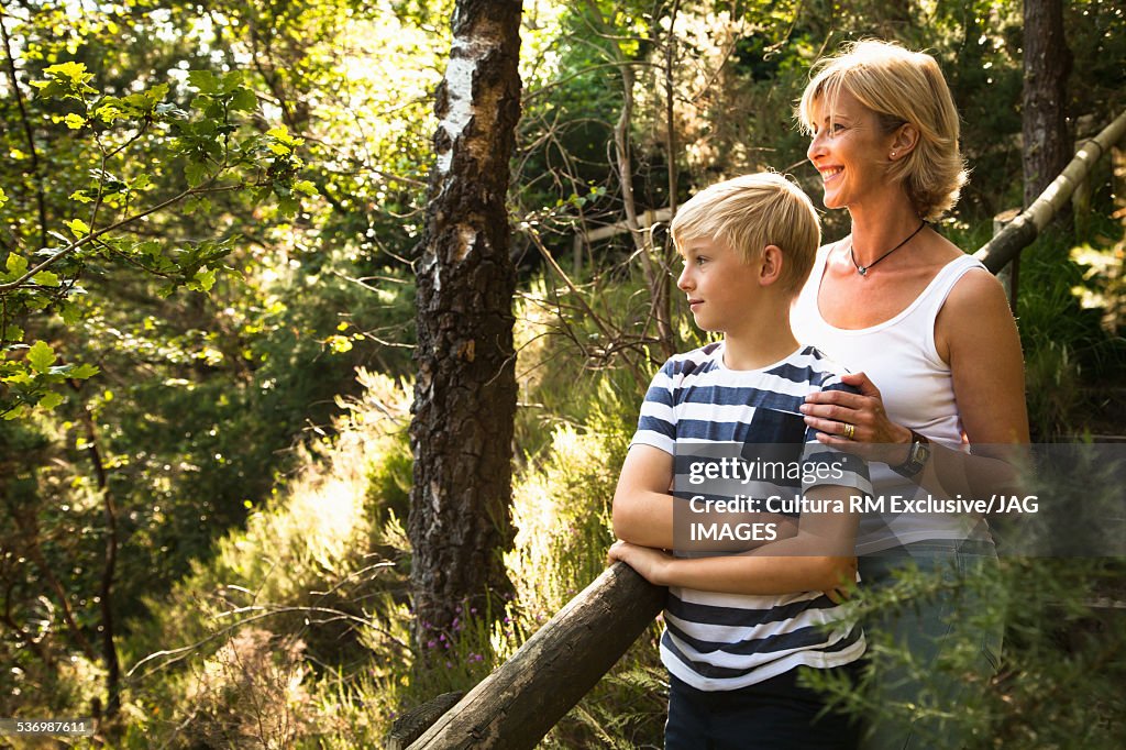 Mother and son in forest, The Blue Pool, Wareham, Dorset