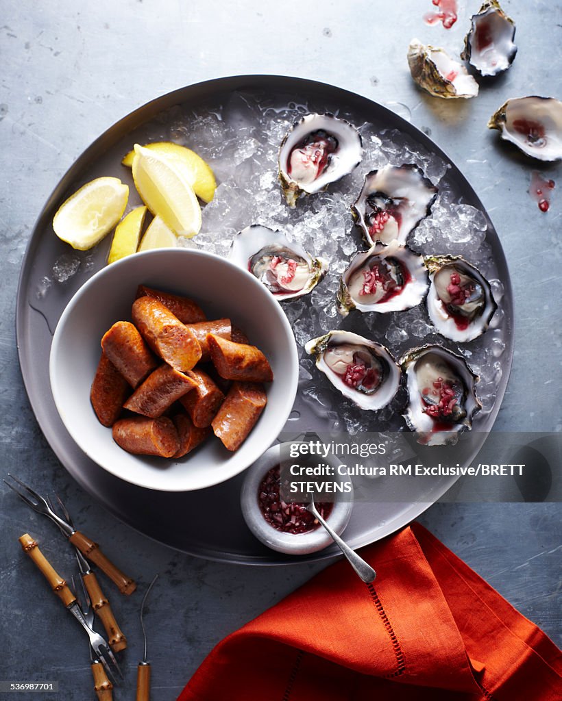 Oysters with shallots and sausages