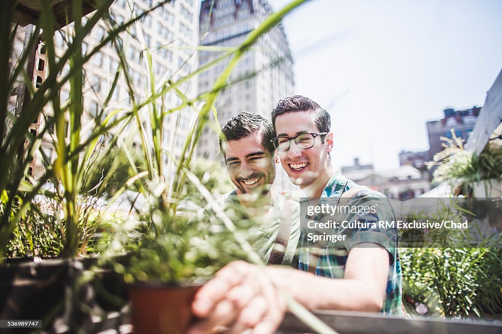 Gay couple buying plants