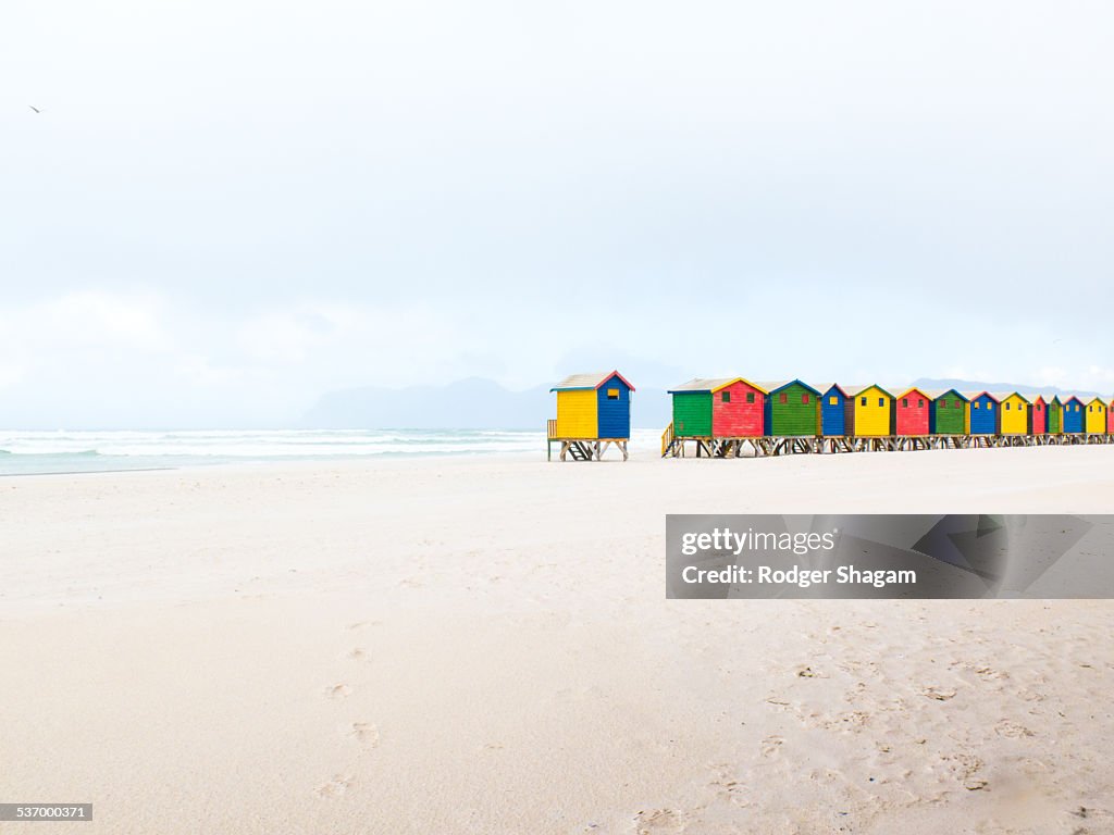 Colourfully painted bathing boxes (cubicles) at Muizenberg beach. Cape Town, South Africa