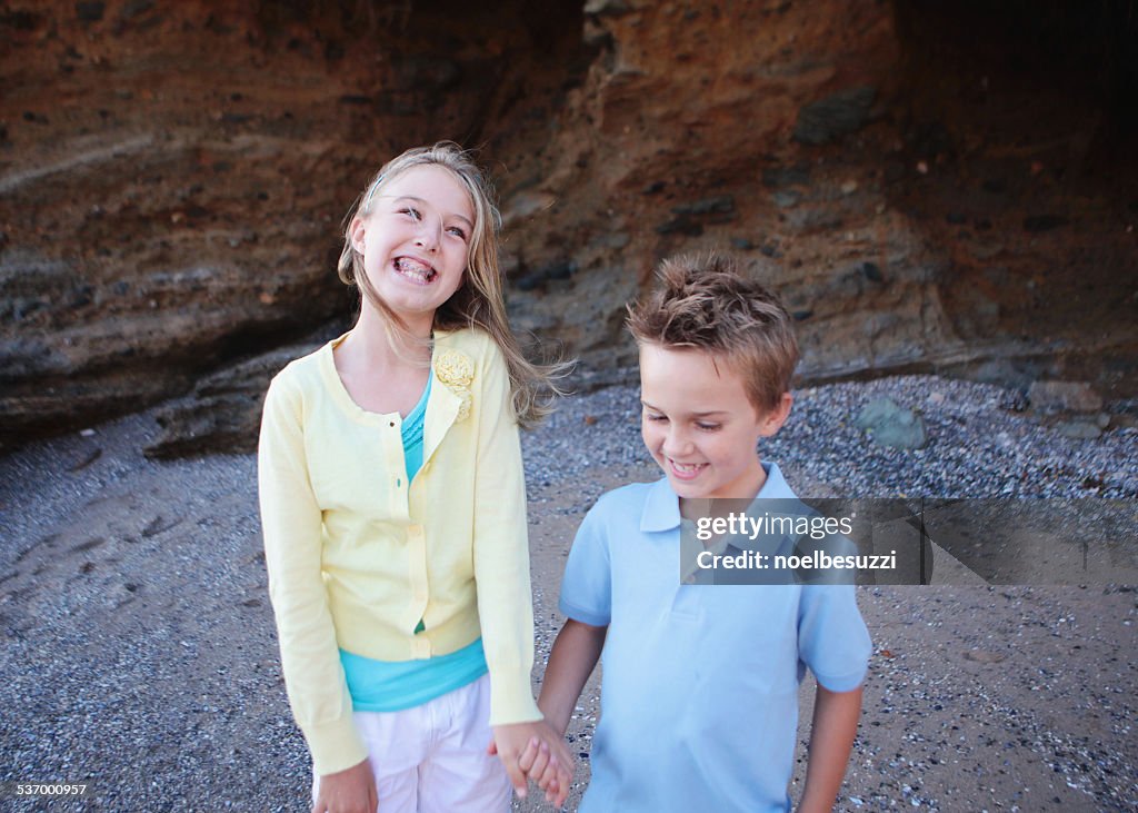 Brother and sister holding hands