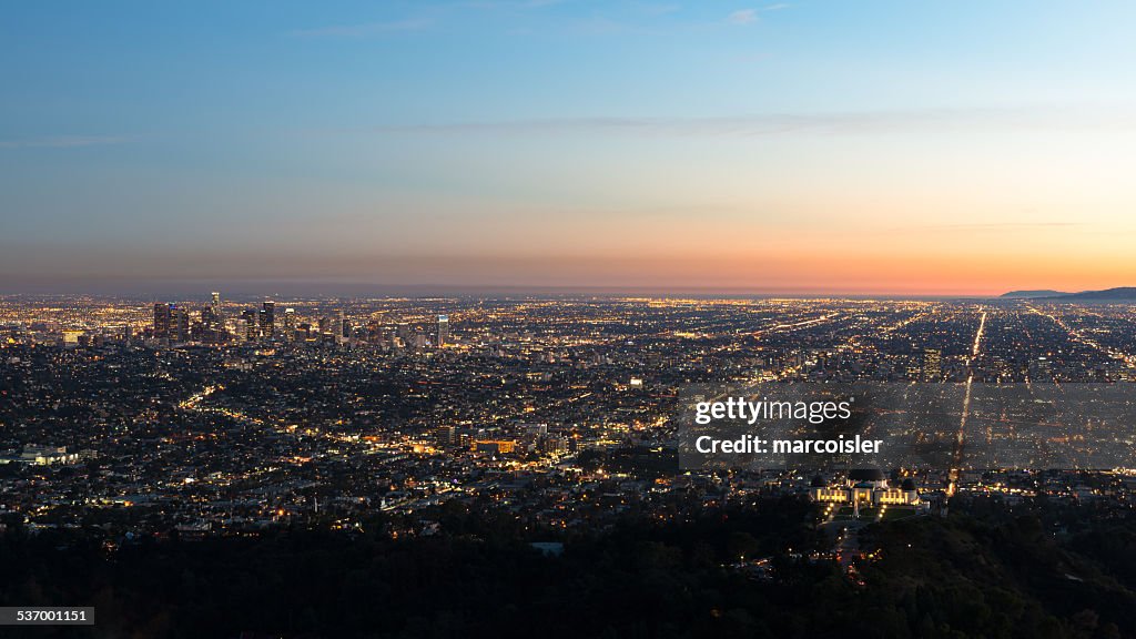 USA, California, Los Angeles, Illuminated cityscape at sunrise