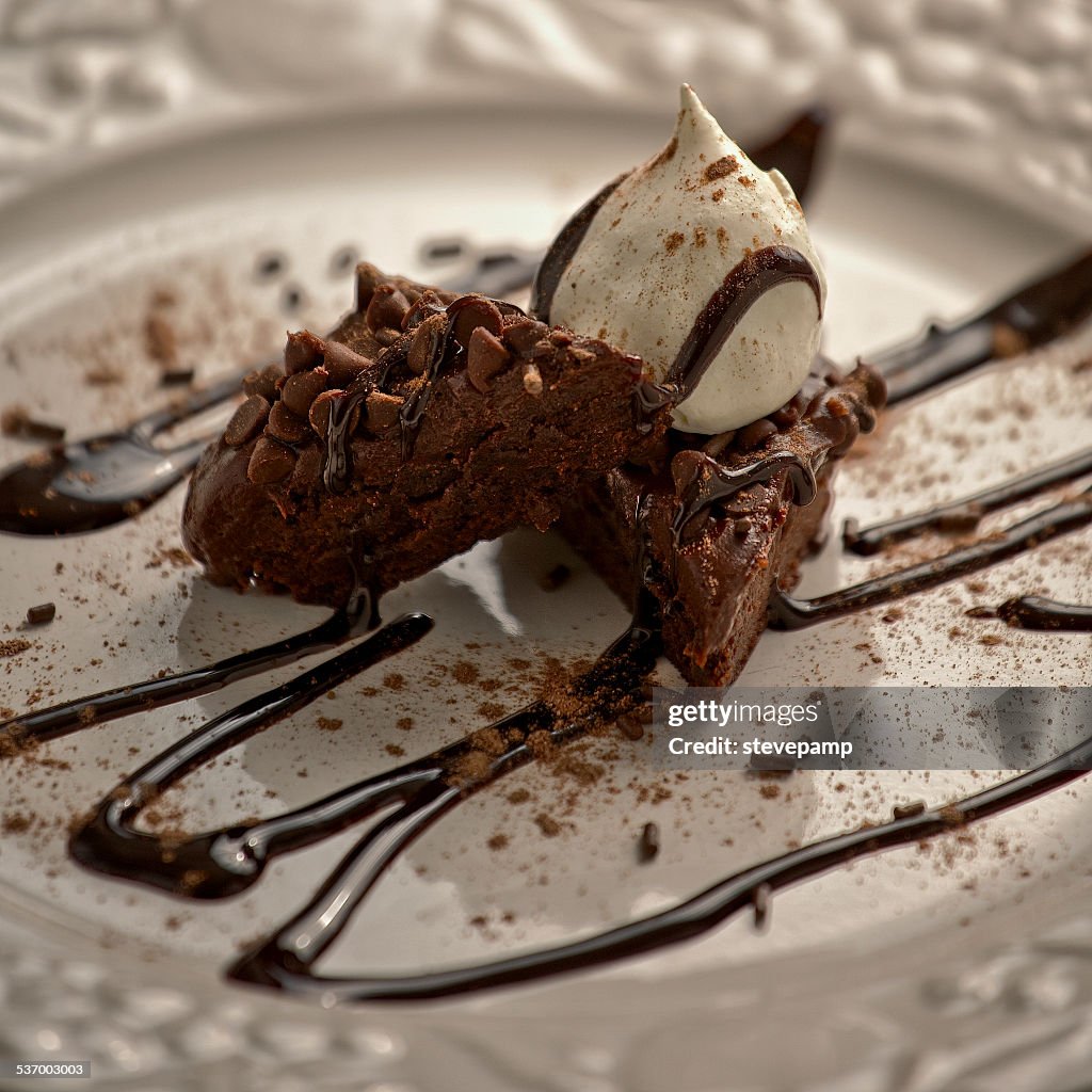 Chocolate brownie with chocolate sprinkles and drizzled chocolate