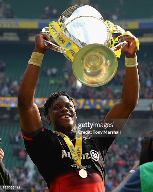 Maro Itoje of Saracens celebrates with the Aviva Premiership Rugby Trophy during the Aviva Premiership final match between Saracens and Exeter Chiefs...