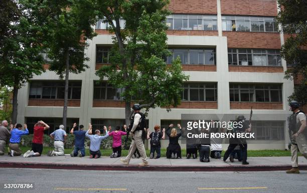 Students and faculty of University of California in Los Angeles are evacuated and searched by police after an active shooting was reported on the...