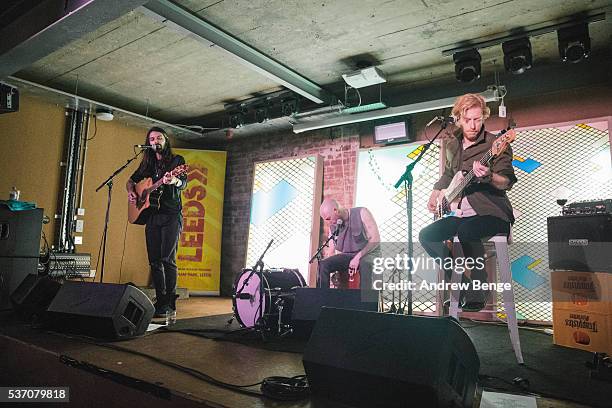 Simon Neil, Ben Johnston and James Johnston of Biffy Clyro perform on stage for Leeds Festival competition winners at Headrow House on June 1, 2016...