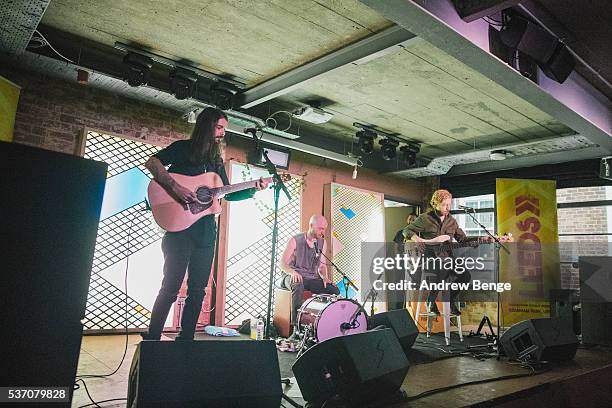 Simon Neil, Ben Johnston and James Johnston of Biffy Clyro perform on stage for Leeds Festival competition winners at Headrow House on June 1, 2016...