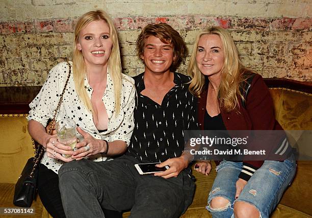 Lara Stone, Jordan Barrett and Meg Mathews attend the launch of the Kate Moss For Equipment x NET-A-PORTER collection at The Chiltern Firehouse on...