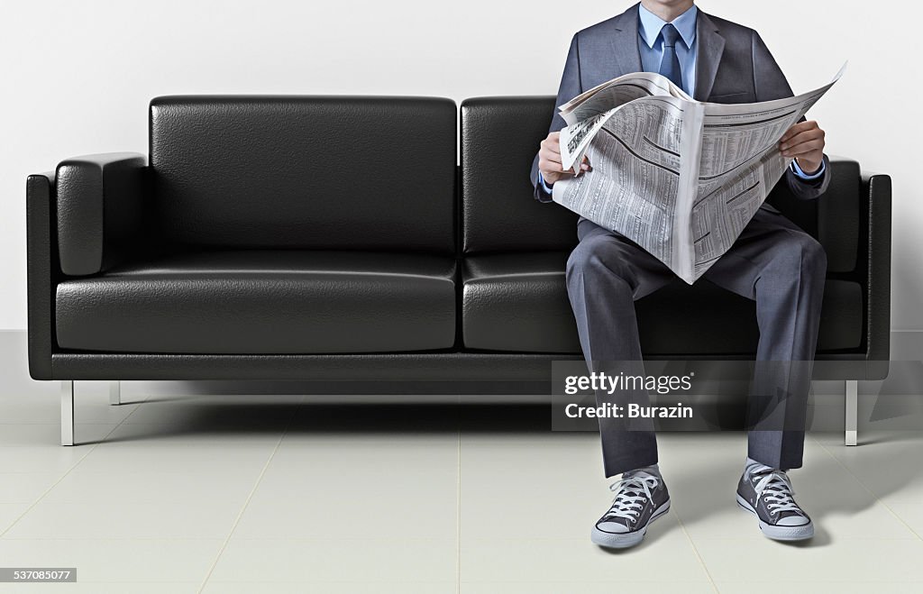 Business man in suit wearing sneakers