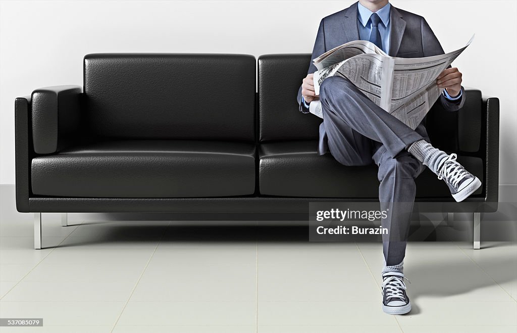 Business man in suit wearing sneakers