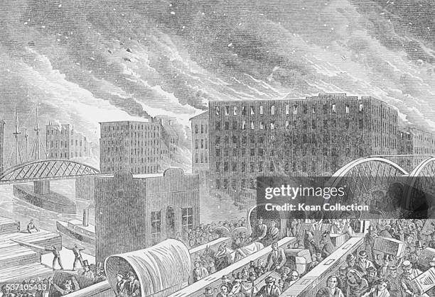 Engraved view of Great Chicago Fire spreading across the city, as people flee the city across a bridge, Illinois, October 1871.