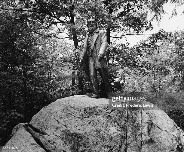 Statue of American poet Walt Whitman, on a rock at Bear Mountain, New York, circa 1940.