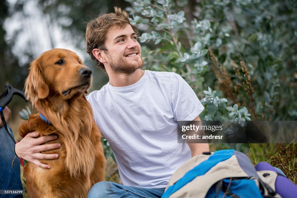 Hiker walking with his dog