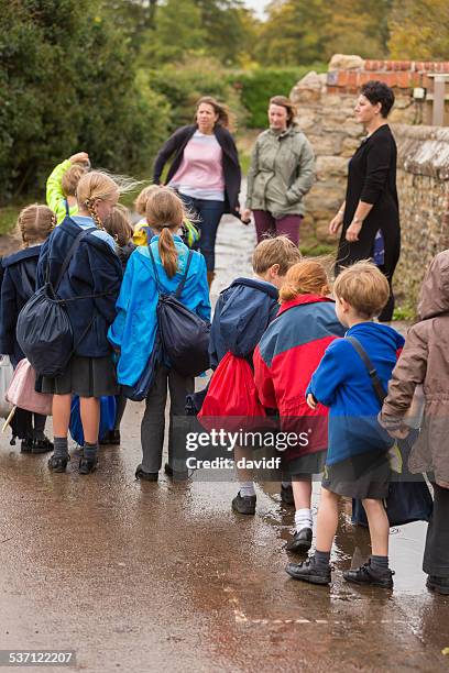 children walking out of school to meet parents - kids lining up stock pictures, royalty-free photos & images