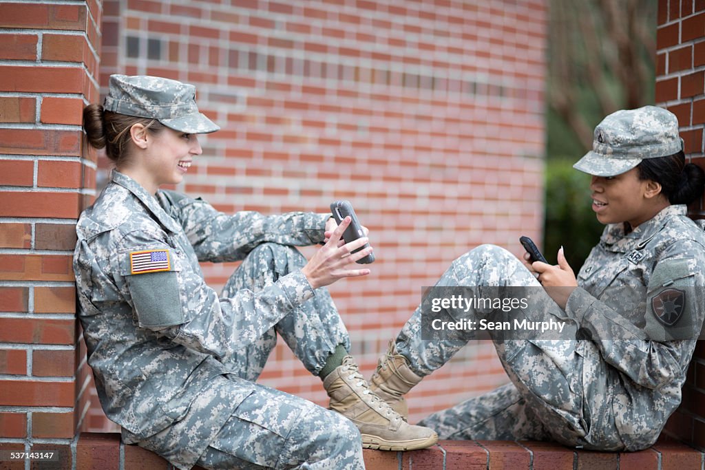 Female Soldiers Using Cell Phones