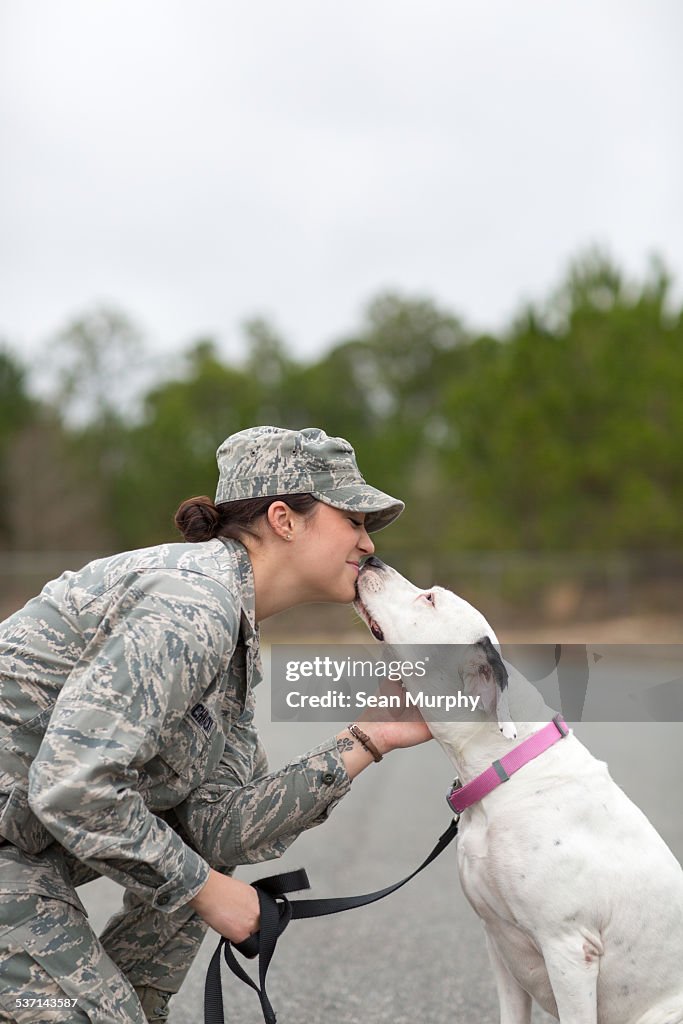 Dog Kissing Female Airforce Soldier