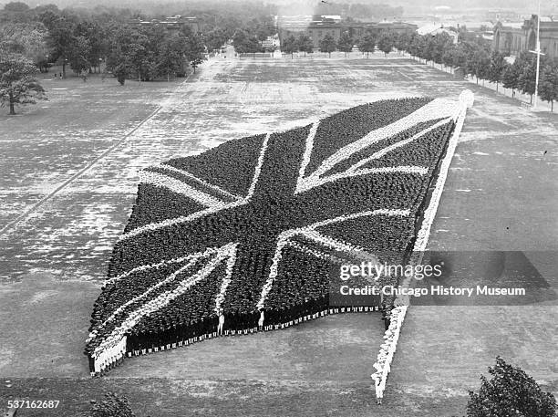 Living photograph of the Union Jack, the flag of the United Kingdom, comprised of many men, taken at the United States Naval Training Station, Great...