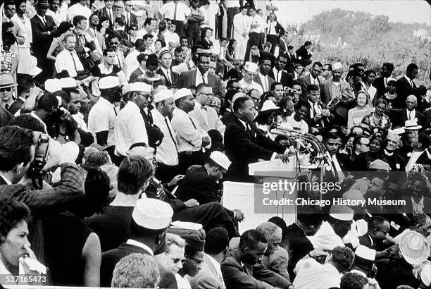 Martin Luther King Jr speaks from behind a podium to a crowd during the March on Washington for Jobs and Freedom in Washington DC, August 28, 1963.