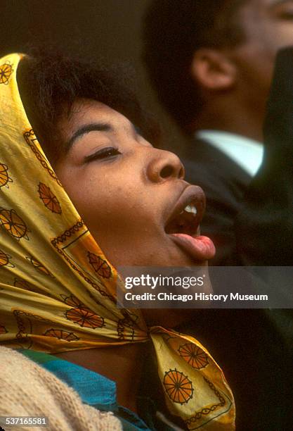 View of a woman in a crowd at one of the Selma to Montgomery Marches, a series of civil rights demonstrations undertaken in support of voting rights,...