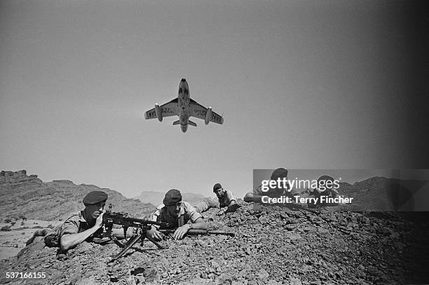 Royal Air Force Hawker Hunters flying above troops of the 45 Commando Royal Marines in the Radfan region during the Aden Emergency, Yemen, 9th March...