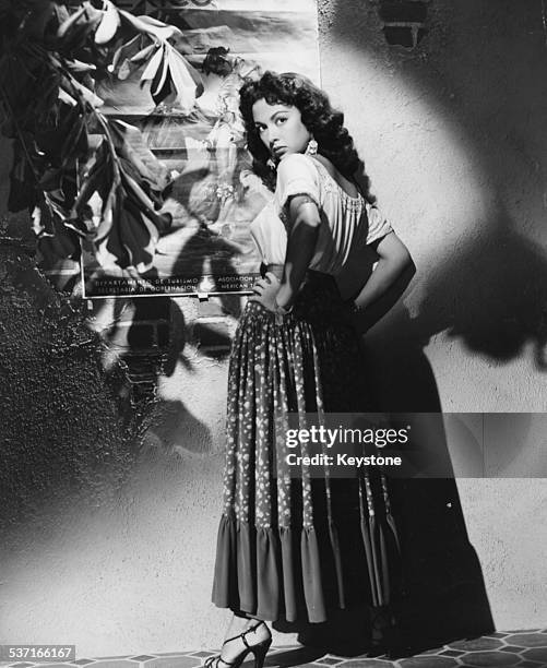 Portrait of actress Rita Moreno, as she appears in the movie 'Cattle Town', 1952.