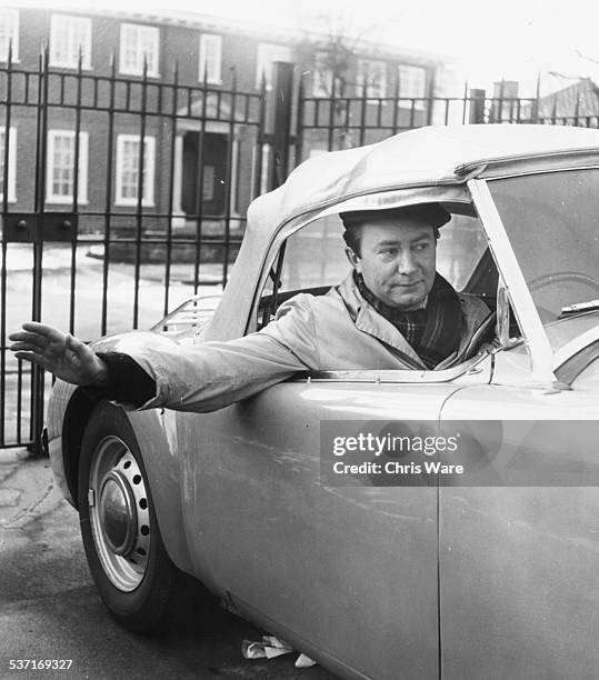 Actor Peter Sallis, soon to play Samuel Pepys in a new BBC television series, photographed in his car as he leaves his home, England, circa 1958.