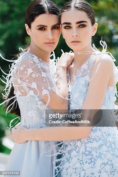 two beautiful girls wearing dresses - haute couture stock pictures, royalty-free photos & images