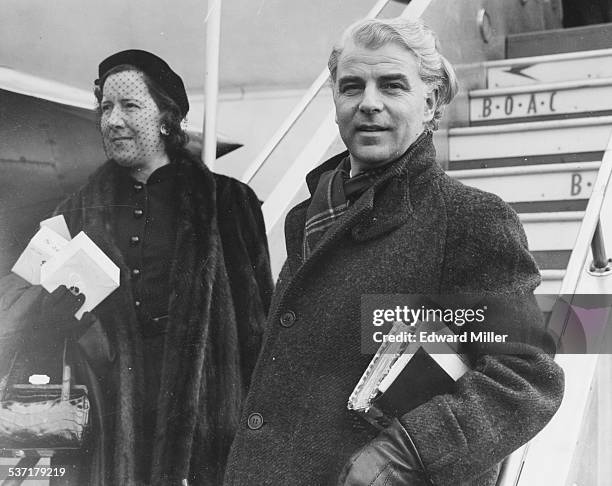 Actor Emlyn Williams and his wife Molly arriving at London Airport, March 17th 1952.